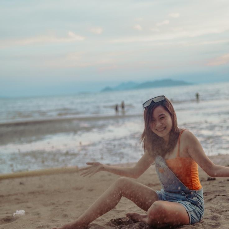 Alexandra Reed, Lead Design Curator at Balanced Forward Path, reviewing corporate floral arrangements